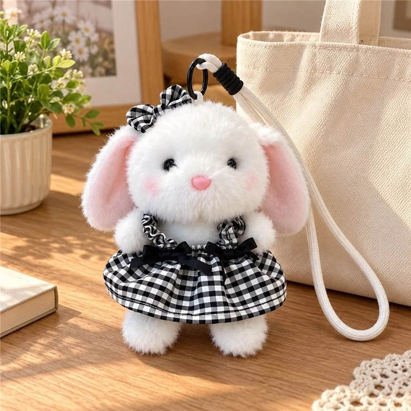 Illustrative application scene featuring black gingham bunny plush charm; setting is a concept.