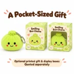 Green Smiling Bun Plush Keychain — optional packaging concept; final artwork, fit and quotation require confirmation.