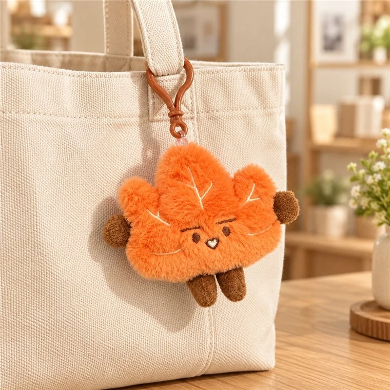 Illustrative application scene featuring orange maple leaf plush keychain; setting is a concept.